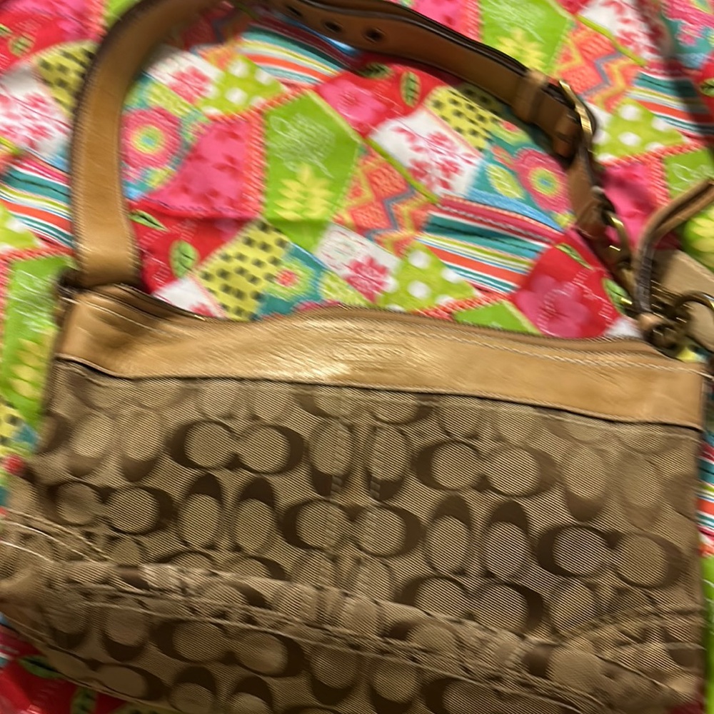 This vintage signature Coach handbag.